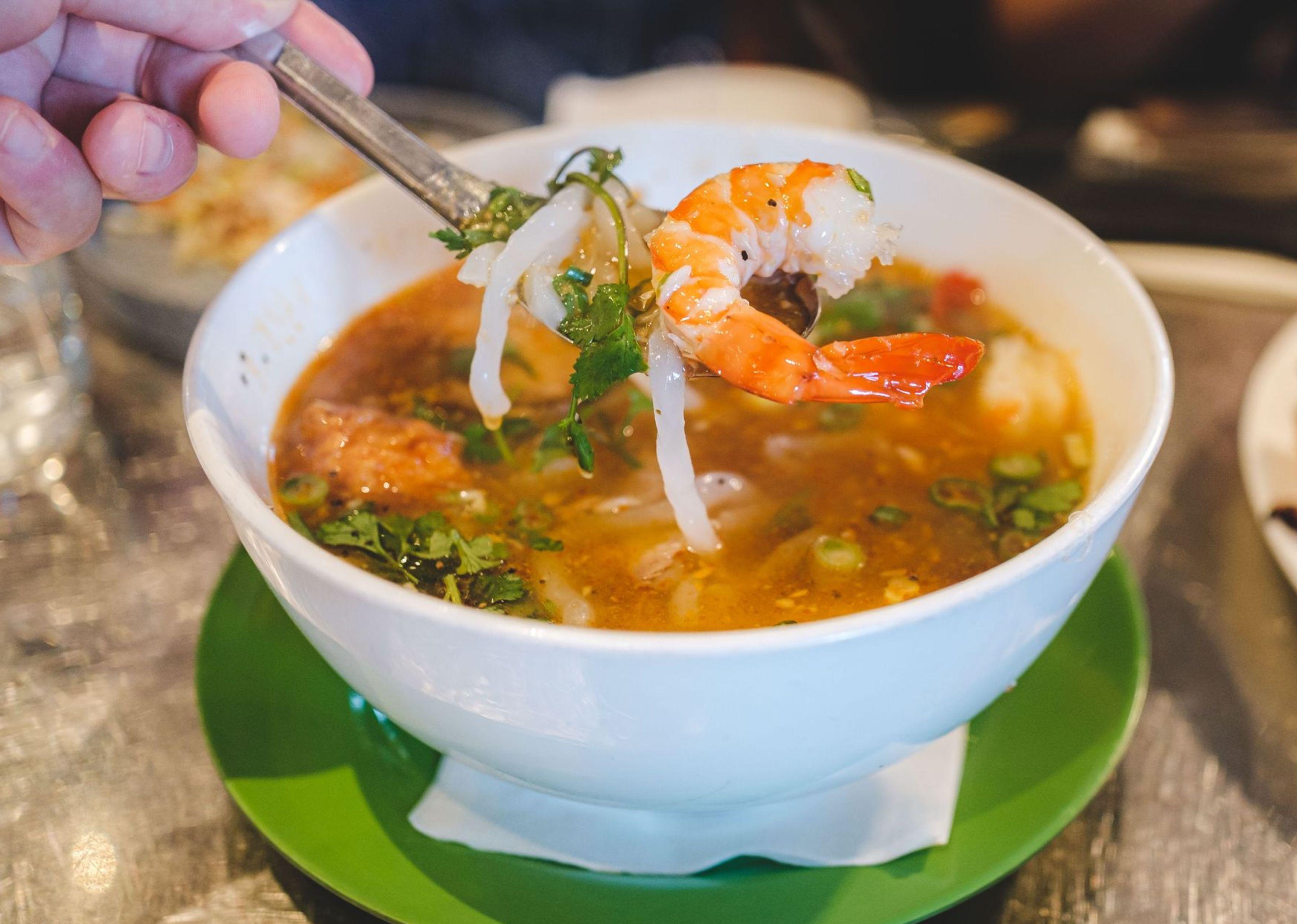 Saigon Commune - Banh Canh Tom Cua with a spoon