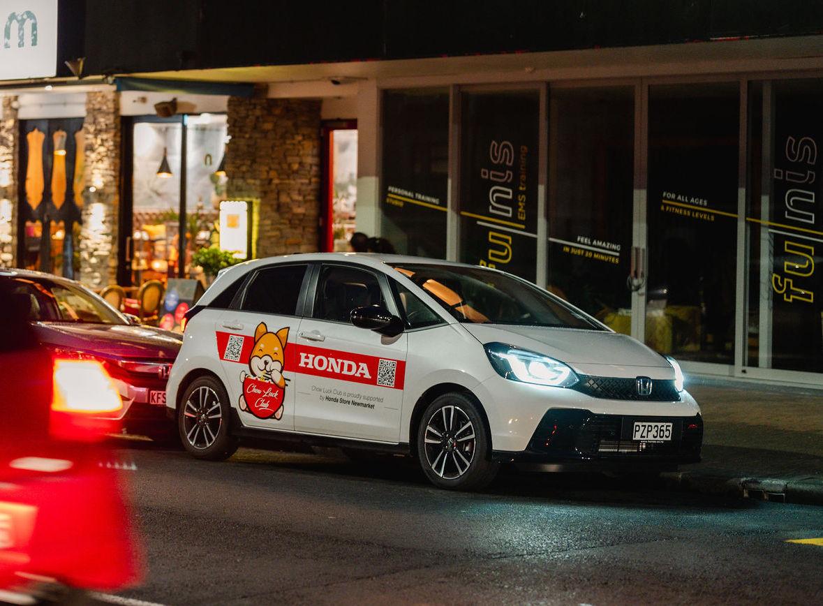 Chow Luck Club Honda Jazz at night